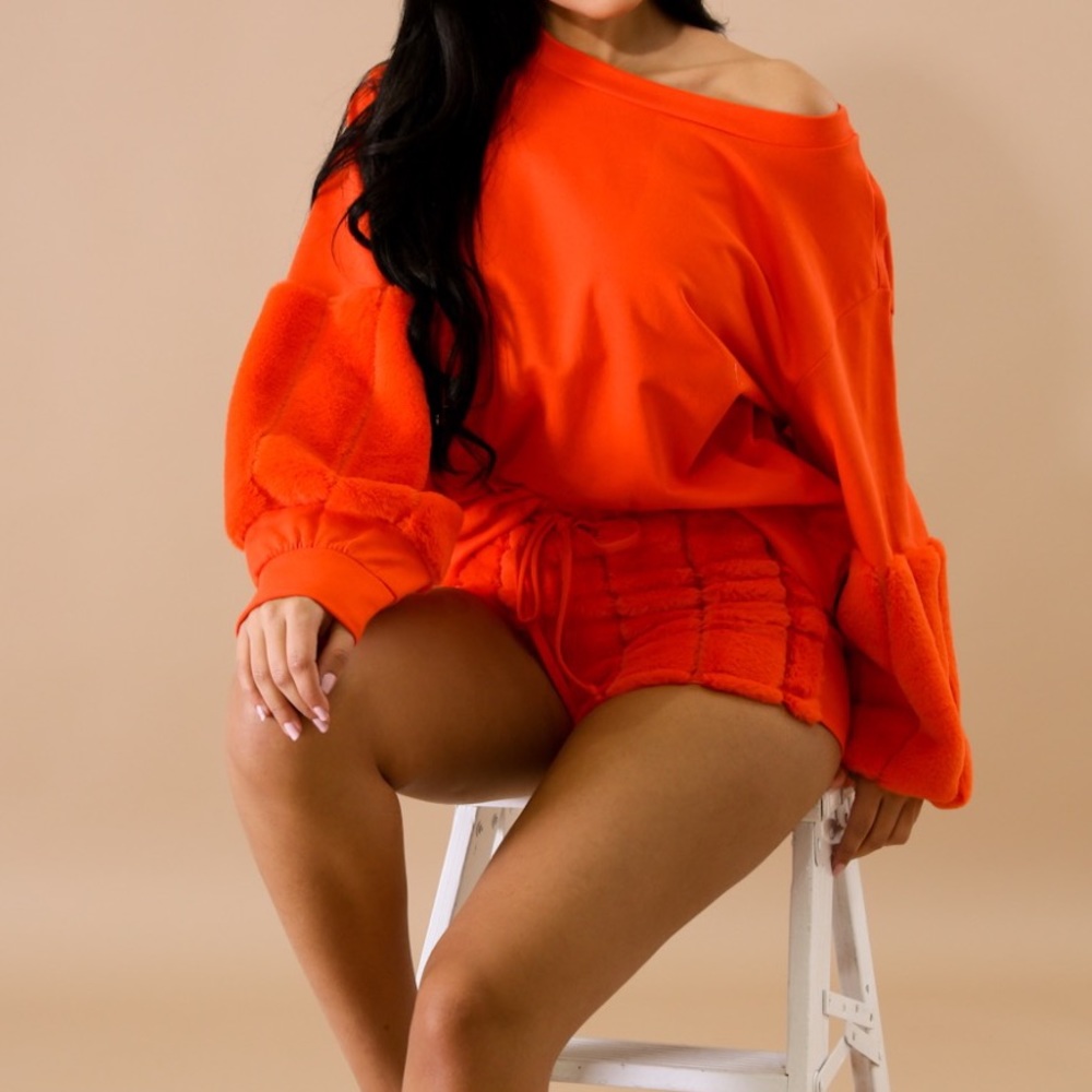 Orange short set. Comes with a sweater top and shorts